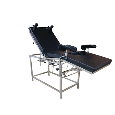 Cama obstétrico elétrica do hospital preto para a ginecologia